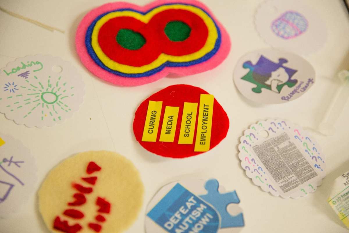 Participants charity badges on display.