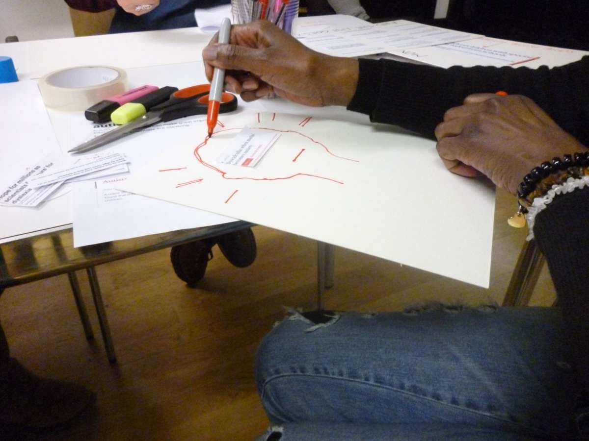 Visitor creating a protest sign.