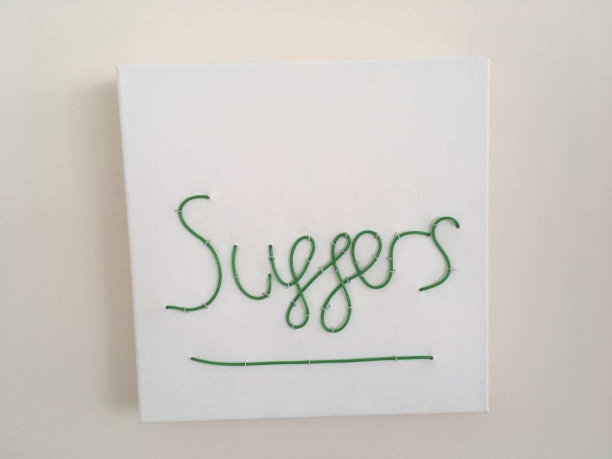 Suffers neon sign on canvas
