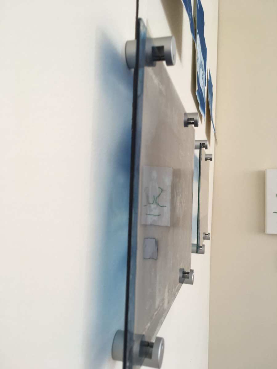 Side view of cyanotypes on glass