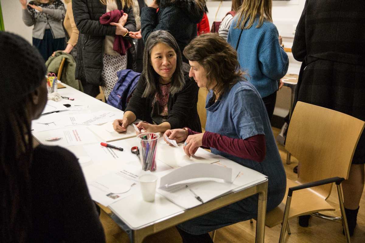 Visitors creating their protest signs and badges.